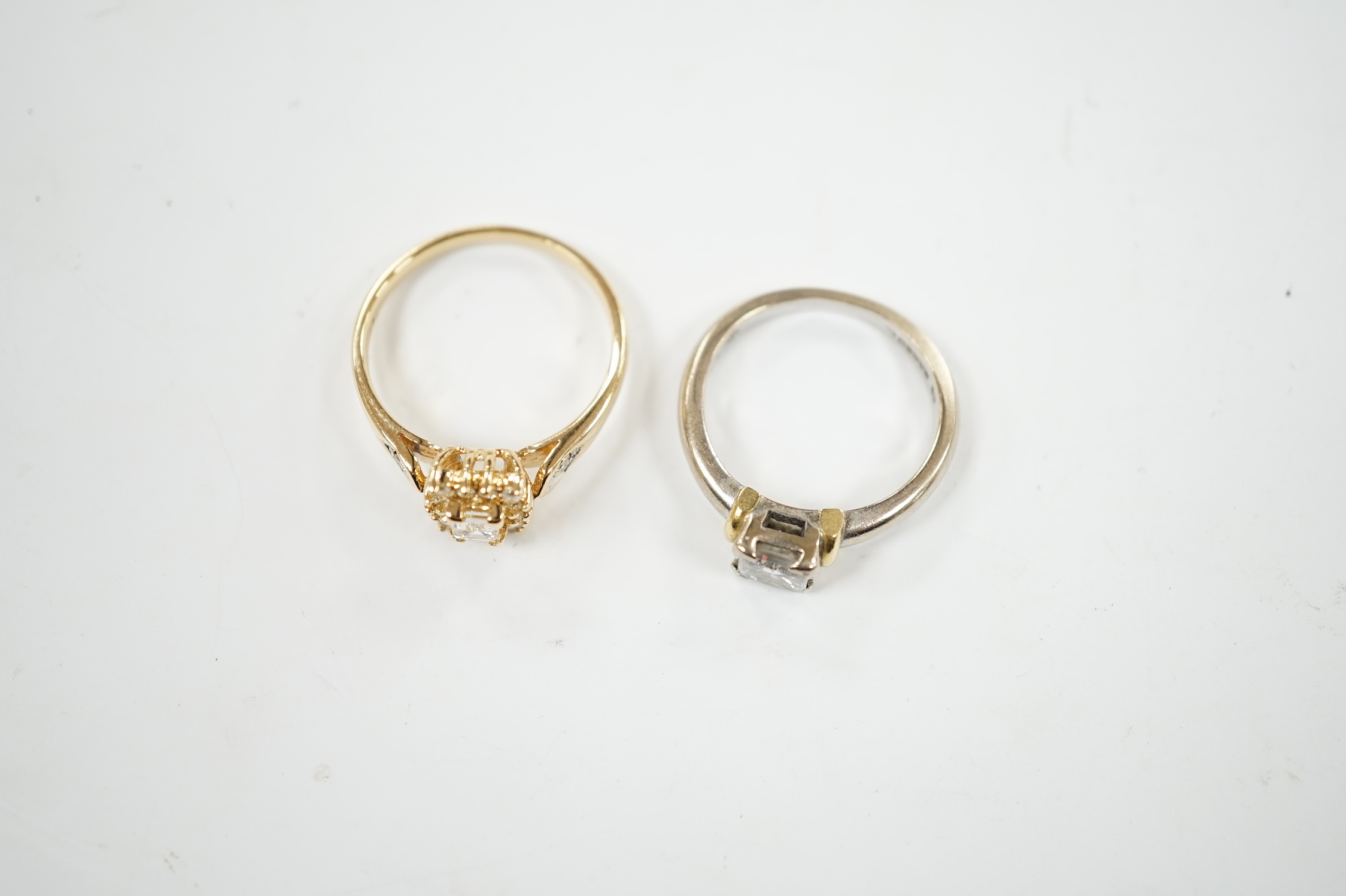 A modern two colour 18ct gold and solitaire princess cut diamond set ring, size K/L and one other modern 18ct gold and diamond set cluster ring, size N, gross weight 7.6 grams.